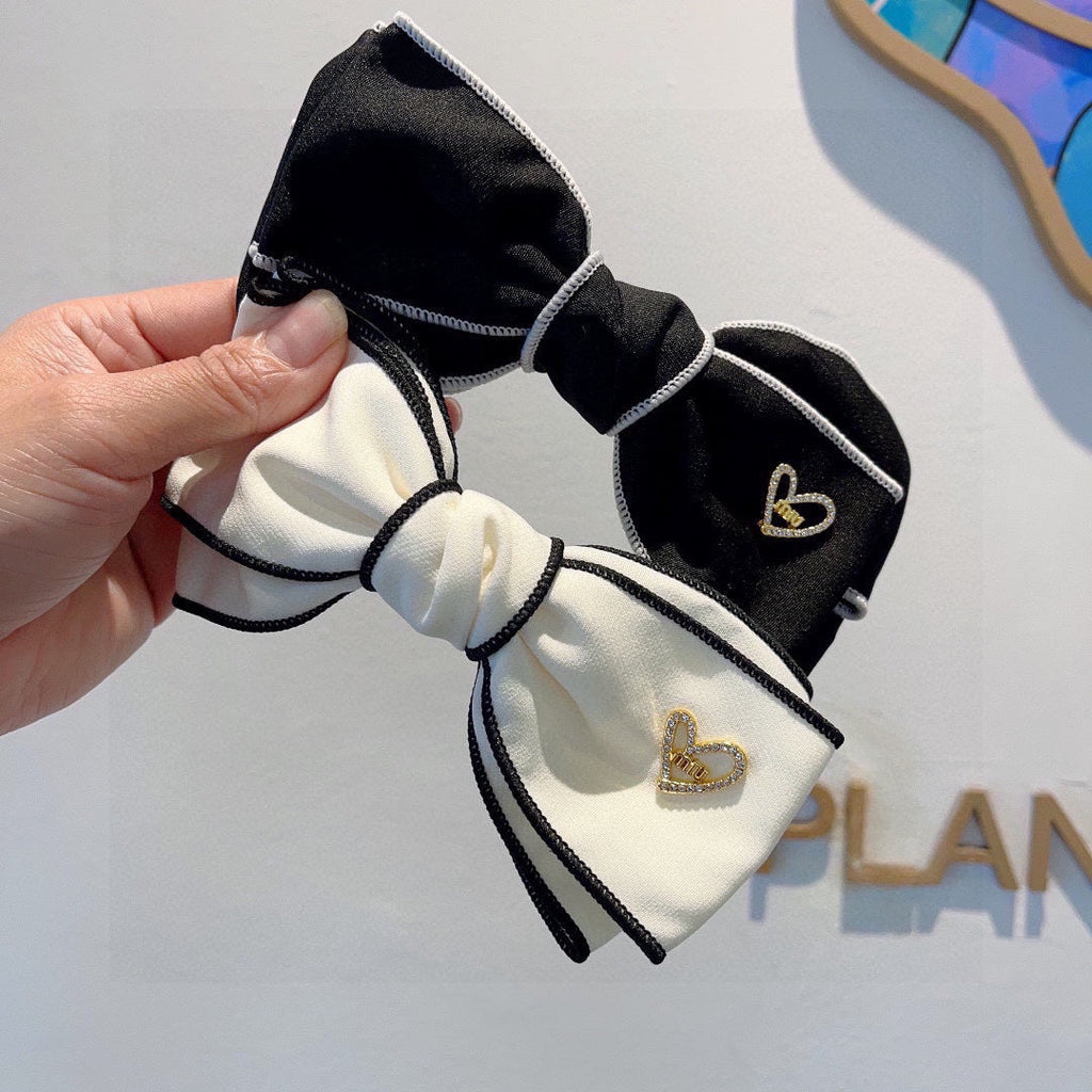 CHANEL BOW HAIRPIN IN BLACK AND WHITE TRIM COTTON 406022