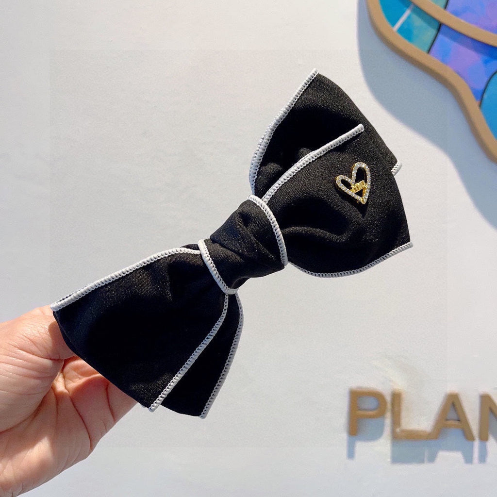 CHANEL BOW HAIRPIN IN BLACK AND WHITE TRIM COTTON 406022