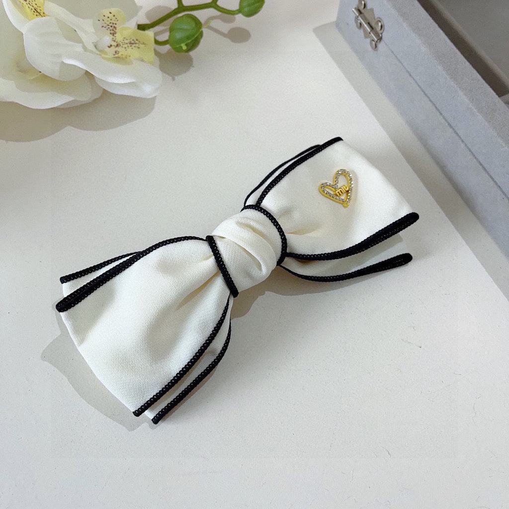 CHANEL BOW HAIRPIN IN WHITE AND BLACK TRIM COTTON 406023