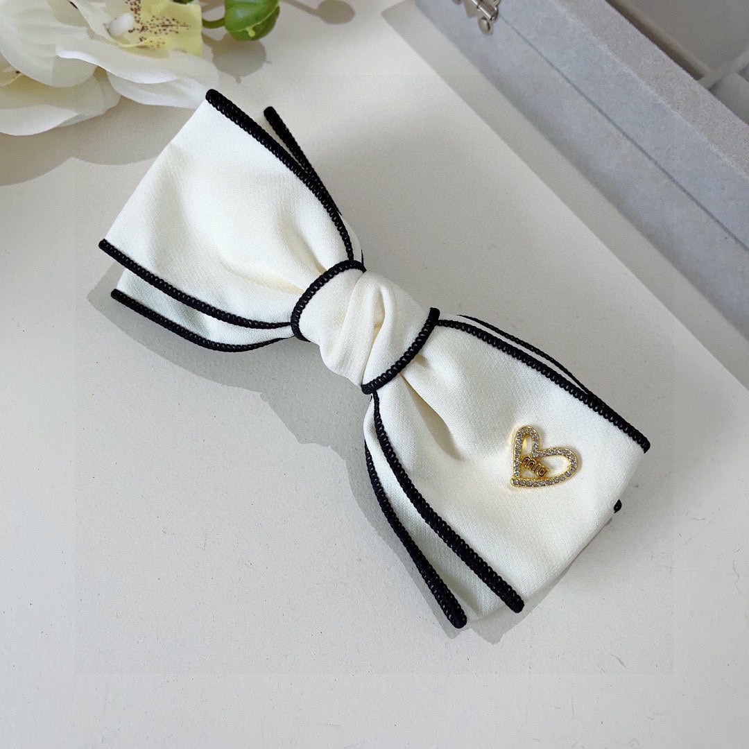 CHANEL BOW HAIRPIN IN WHITE AND BLACK TRIM COTTON 406023