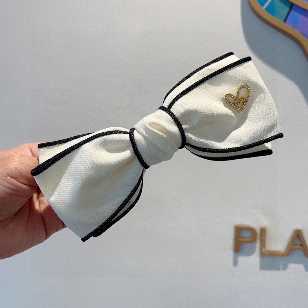 CHANEL BOW HAIRPIN IN WHITE AND BLACK TRIM COTTON 406023